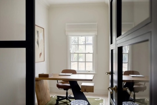 Quiet study with timber desk and sash window