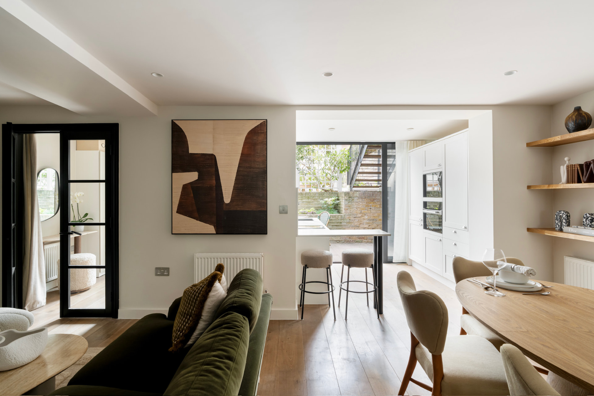 Living and dining space looking through to the kitchen and garden