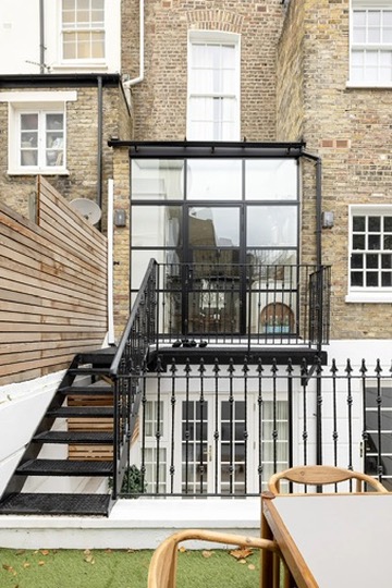 Rear elevation with steel staircase and glazed extension